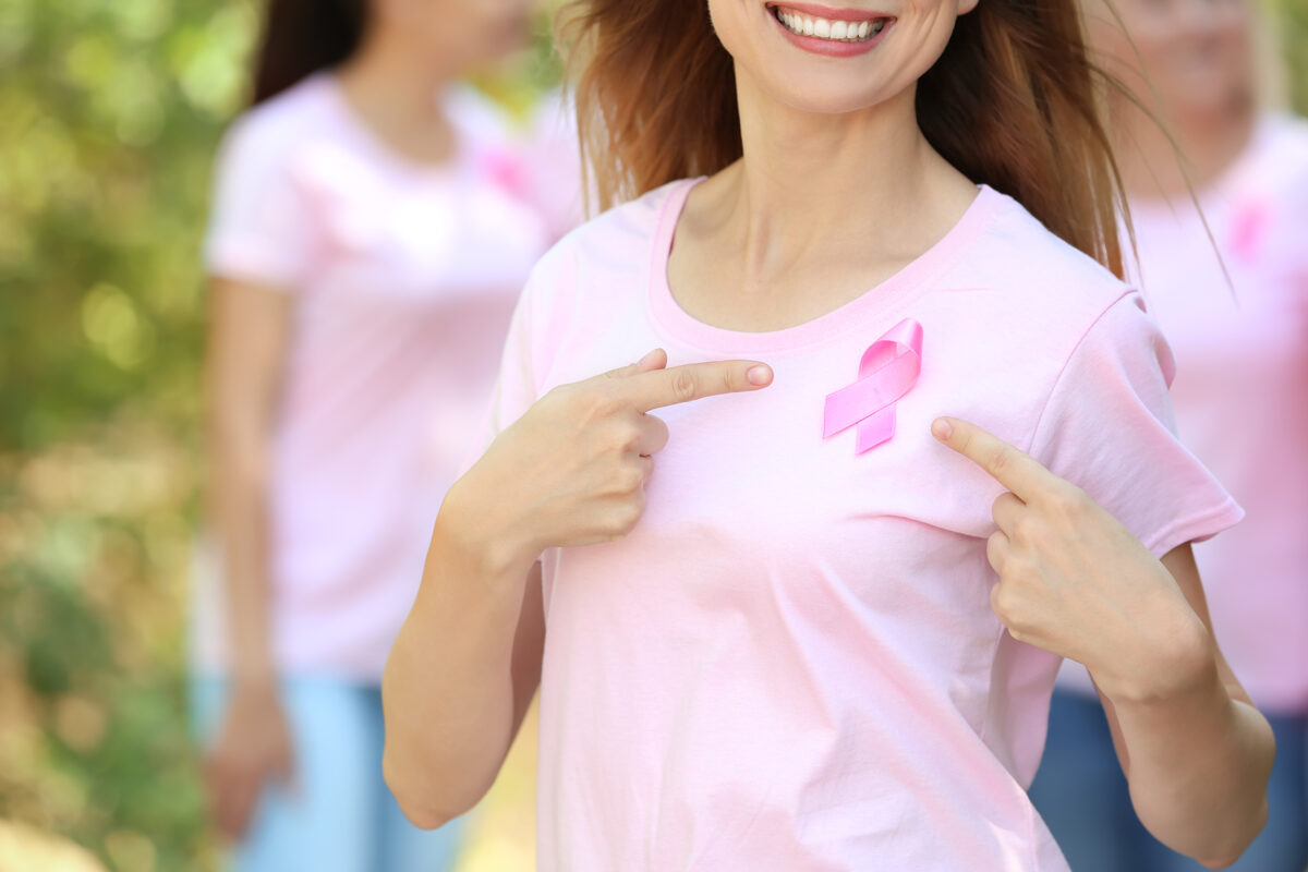 beautiful-woman-with-pink-ribbon-outdoors-breast-cancer-concept.jpg